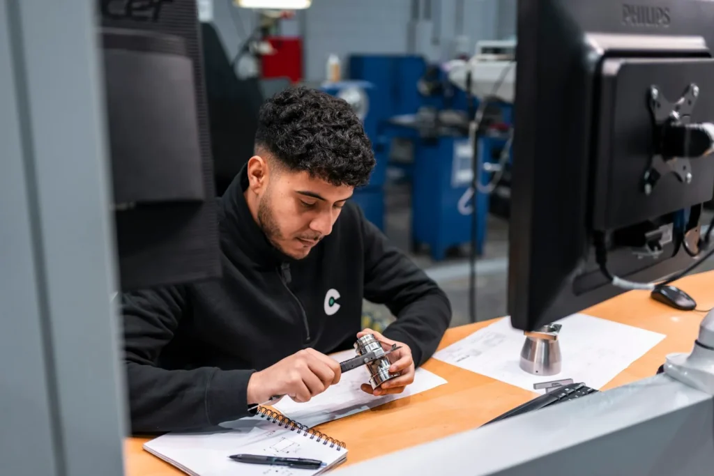 Technician working on hardware at his desk