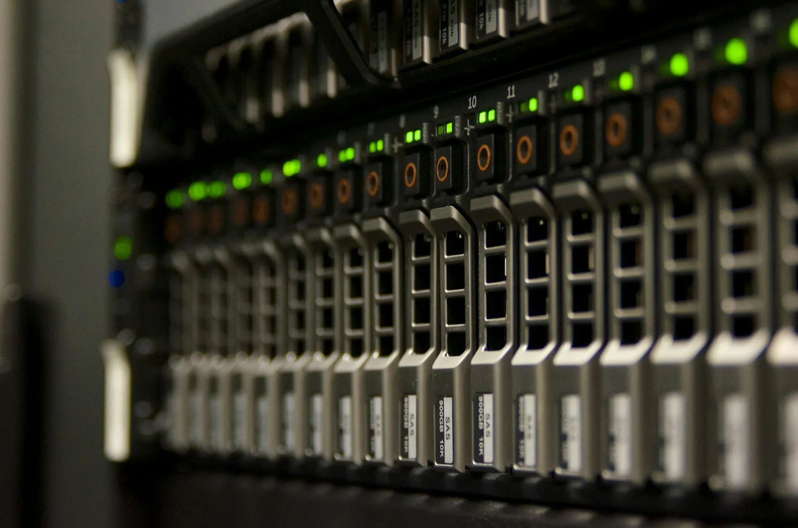 Rack of servers with indicator lights in a small data room