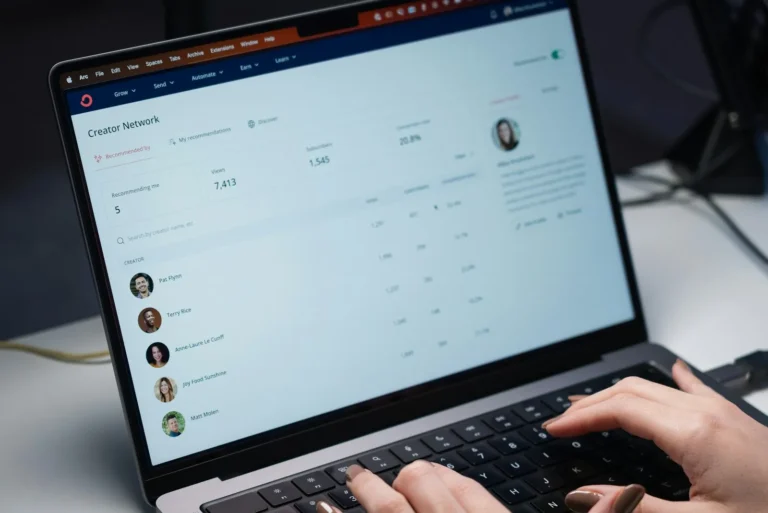 Laptop screen showing an email inbox on an office desk