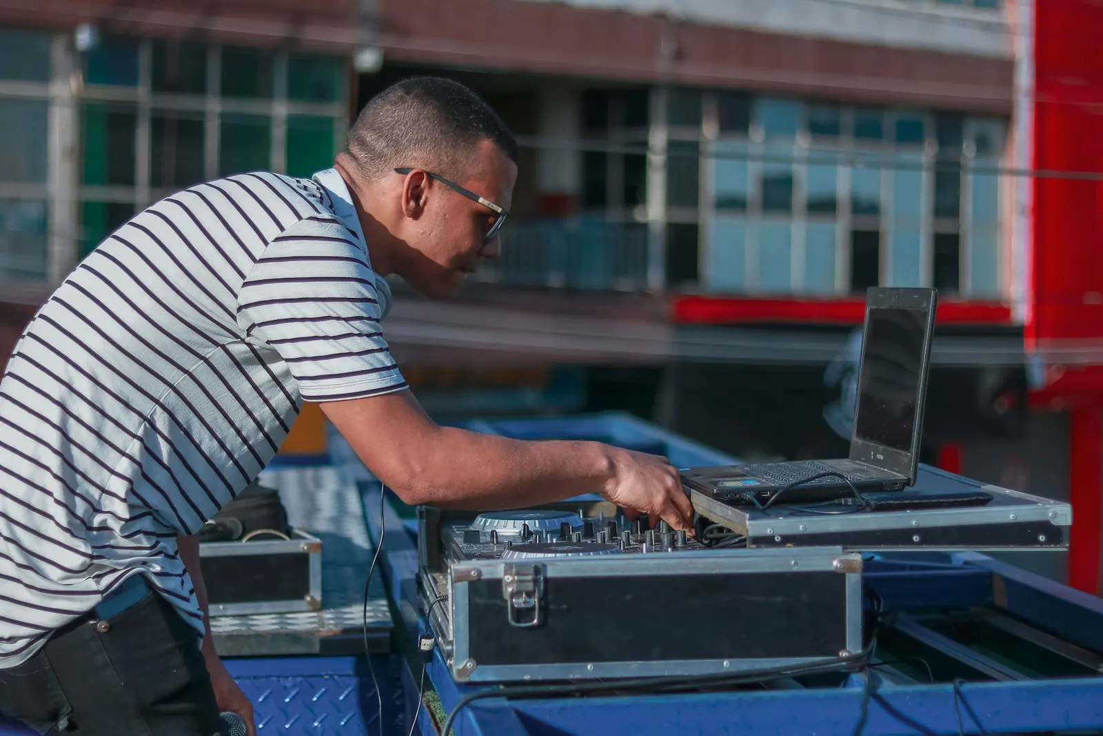 Technician working on equipment in a rolling case