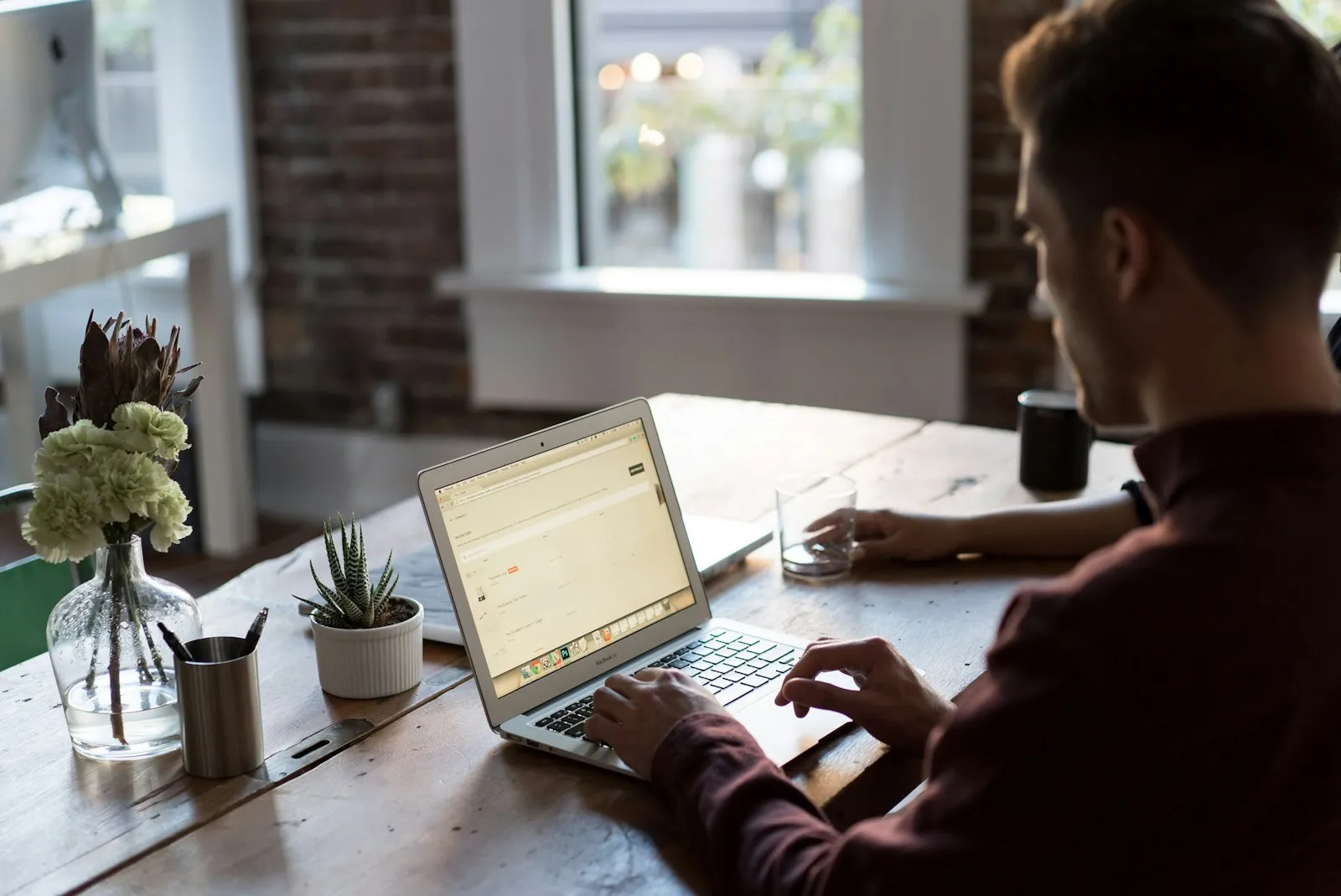 Employee working on a laptop at an office desk