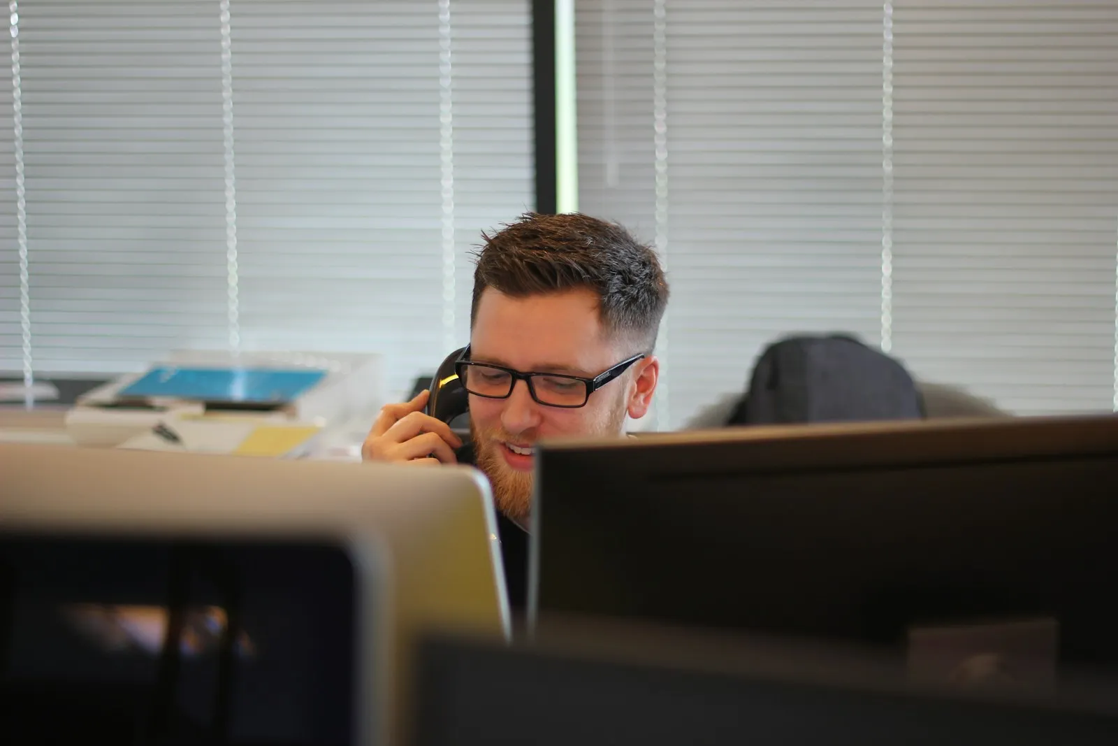 Man on a phone call in an office