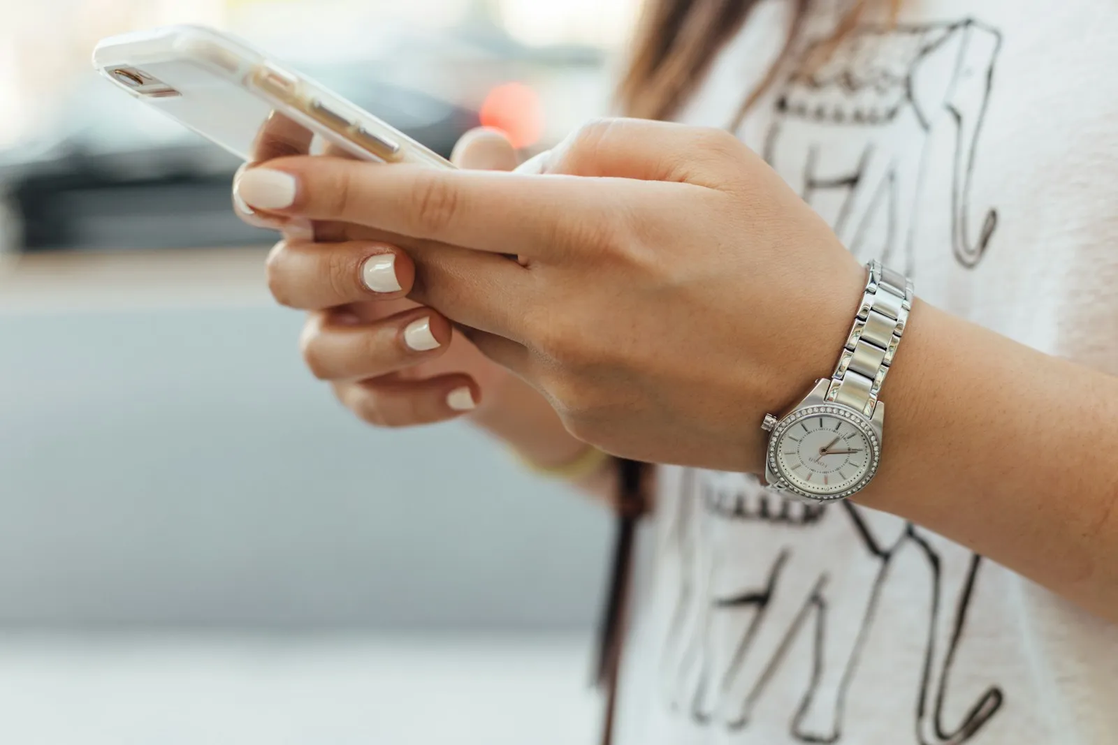 Hands holding a smartphone while texting