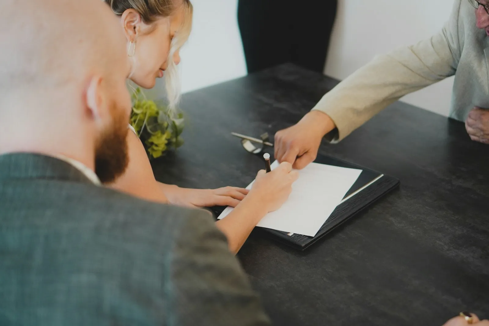 Two people reviewing a document at a table