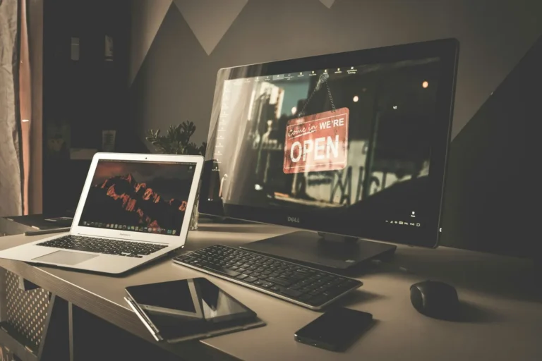 Office worker looking at a laptop screen showing an unexpected warning message
