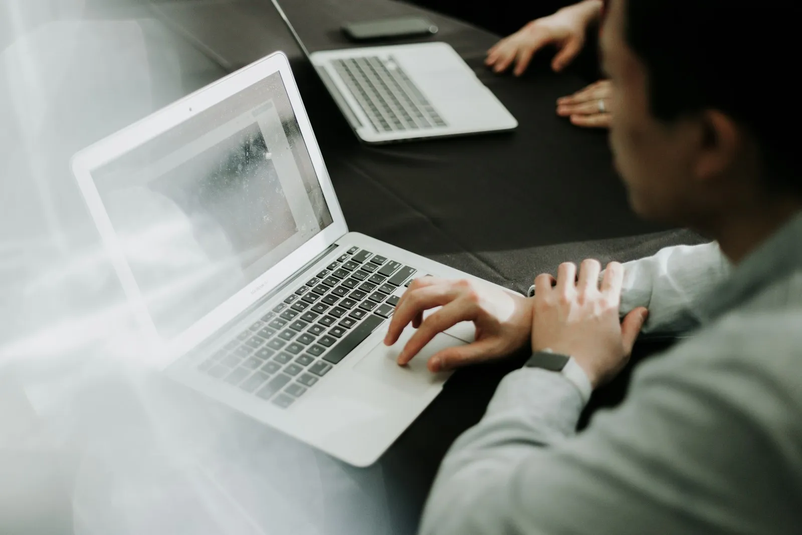 Person typing on a laptop