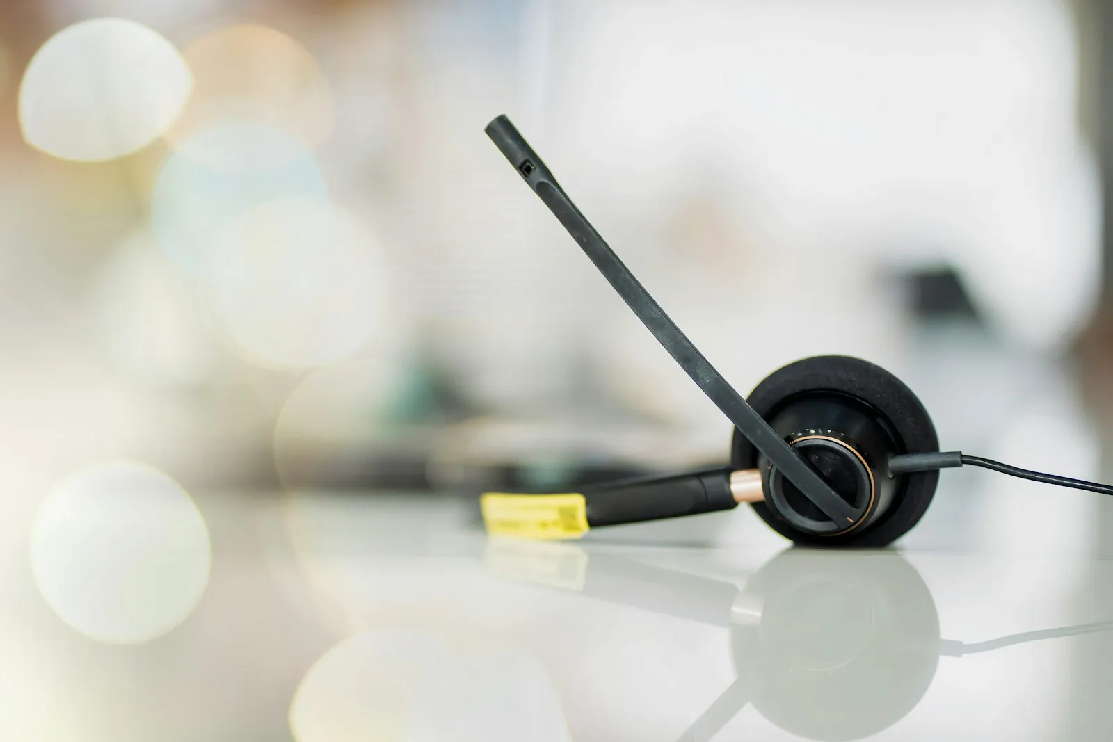 Office headset resting on a desk