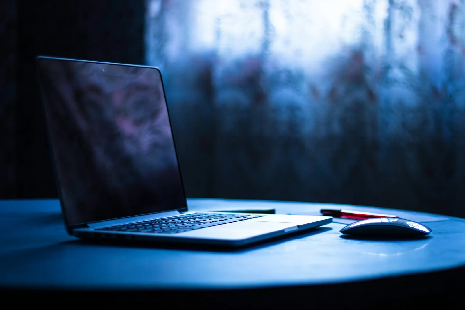 A security analyst reviewing endpoint alerts on multiple monitors