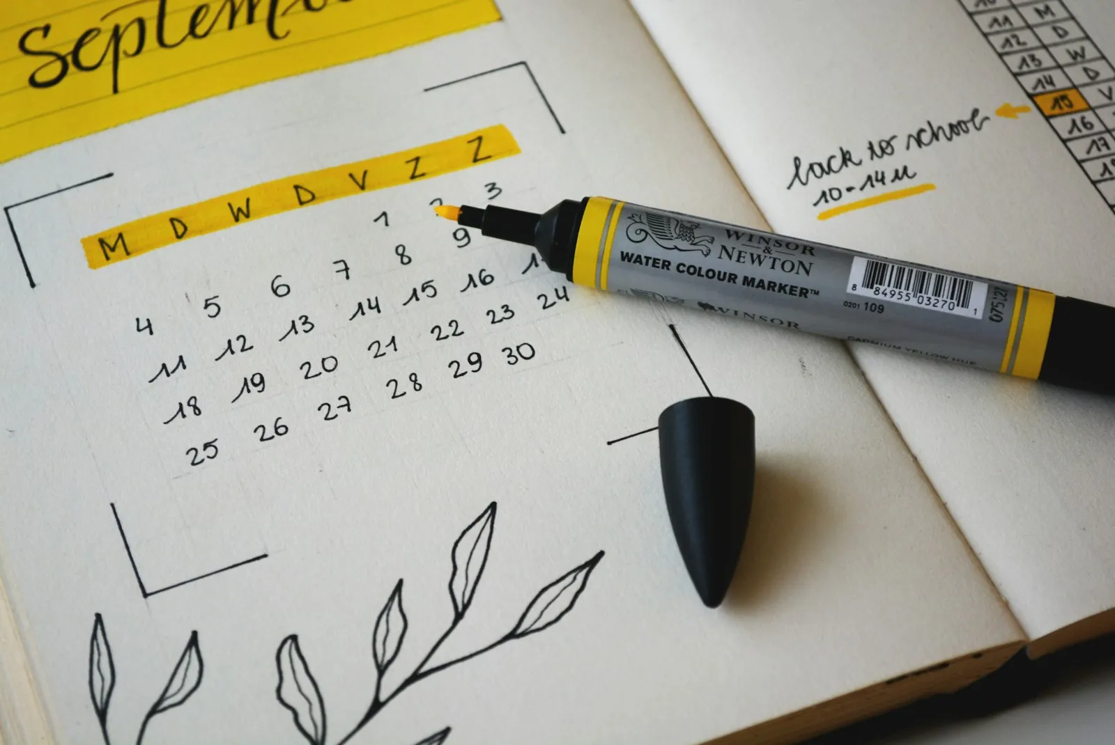 Hand-drawn calendar page with a highlighter for planning